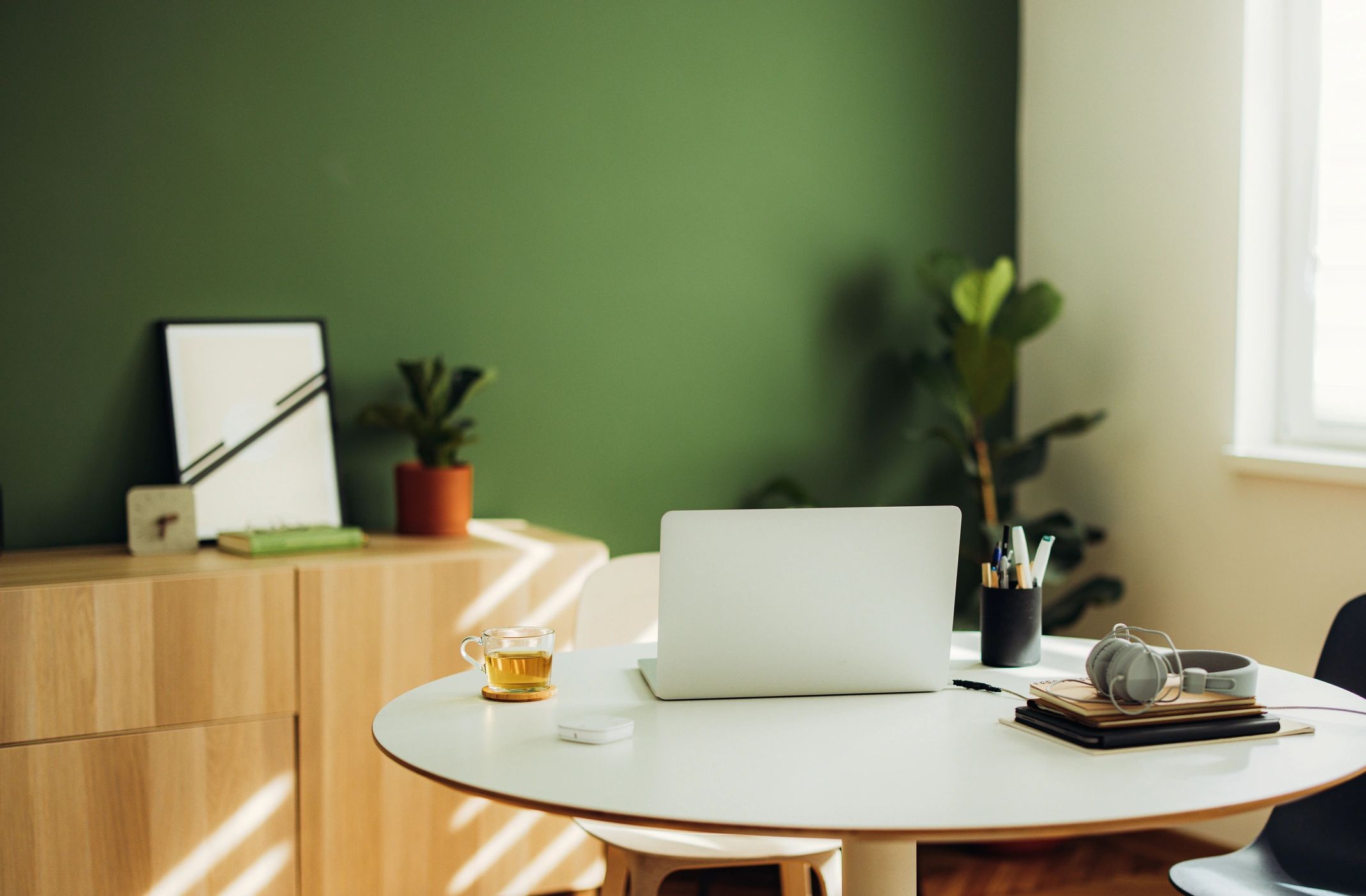 Minimal desk with laptop and notebook